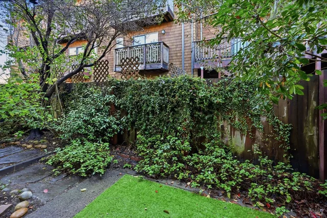a view of a house with a yard and plants
