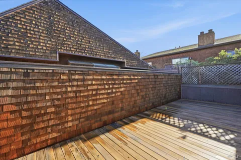 a view of outdoor space with wooden floor