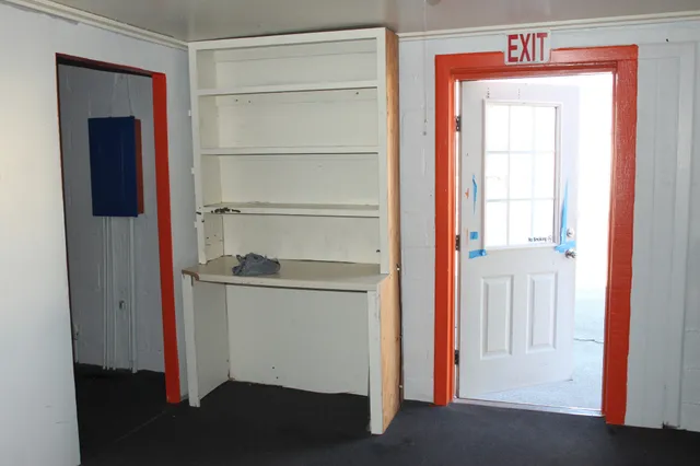 an empty room with a door