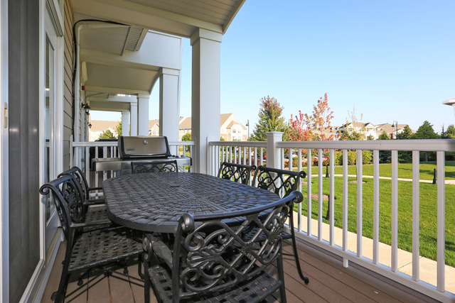 2808 Commons Drive Glenview, IL 60026 - Photo 13 of 14 a view of a dining room with furniture window and wooden floor