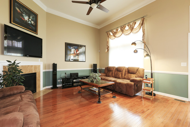 2808 Commons Drive Glenview, IL 60026 - Photo 3 of 14 a living room with furniture a fireplace and a flat screen tv