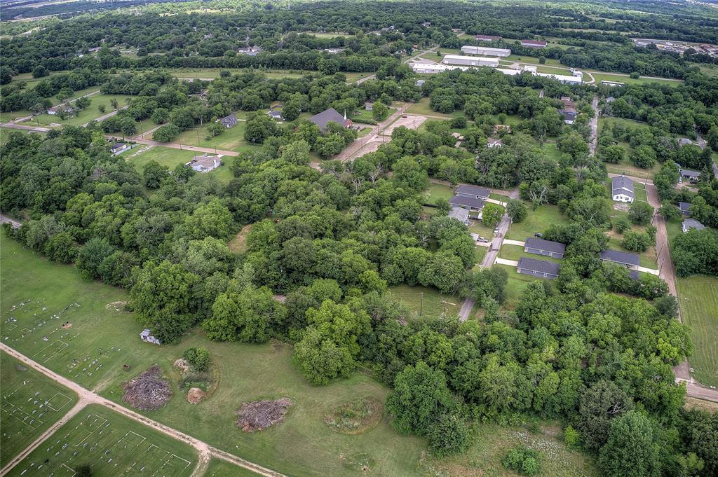 0 Sycamore Street Commerce, TX 75428 - Photo 4 of 14 an aerial view of residential houses with outdoor space and trees