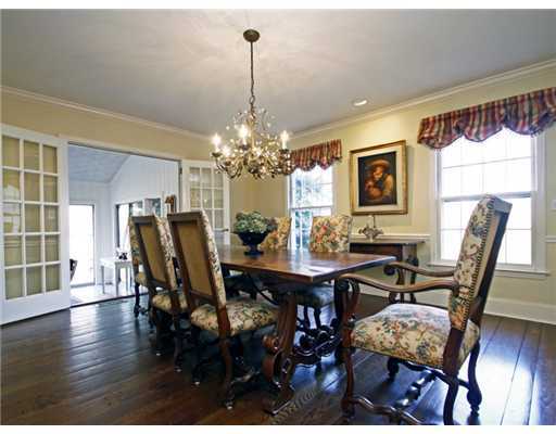 292 Brushy Ridge Road New Canaan, CT 06840 - Photo 4 of 16 a view of a dining room with furniture window and wooden floor