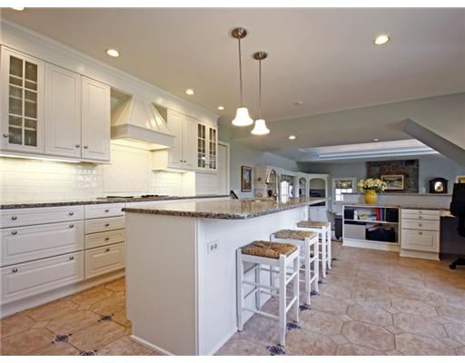 292 Brushy Ridge Road New Canaan, CT 06840 - Photo 5 of 16 a kitchen with cabinets and chairs