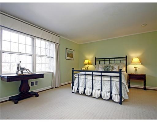 292 Brushy Ridge Road New Canaan, CT 06840 - Photo 9 of 16 a bedroom with furniture and a window
