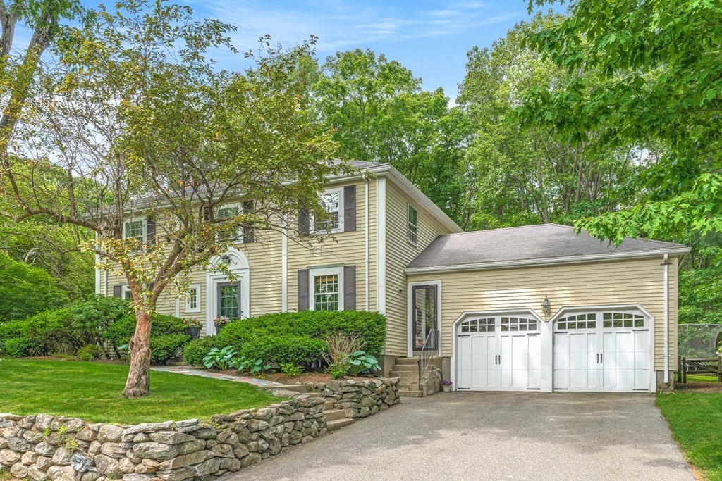 104 Westgate Wellesley, MA 02481 - Photo 1 of 31 a front view of a house with a garden