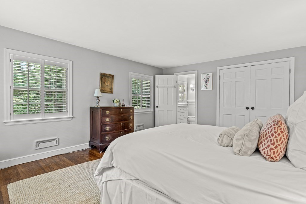 104 Westgate Wellesley, MA 02481 - Photo 19 of 31 a bedroom with a bed and a dresser