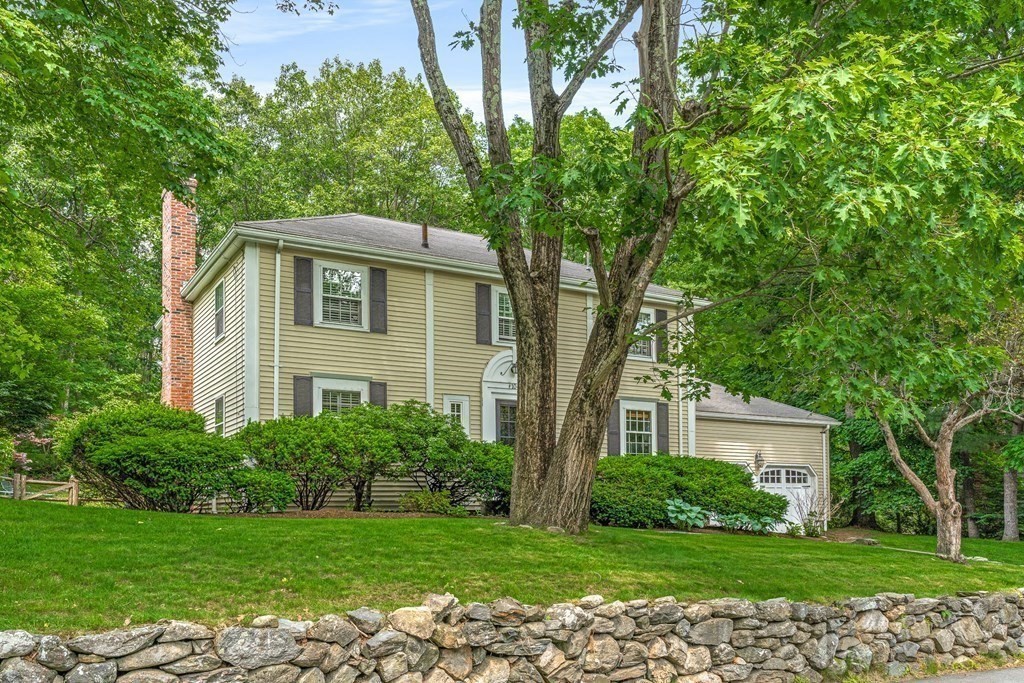 104 Westgate Wellesley, MA 02481 - Photo 2 of 31 a front view of a house with a garden