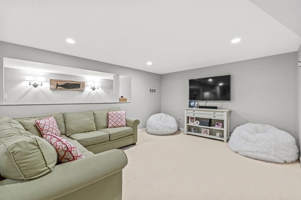 104 Westgate Wellesley, MA 02481 - Photo 22 of 31 a living room with furniture and a flat screen tv