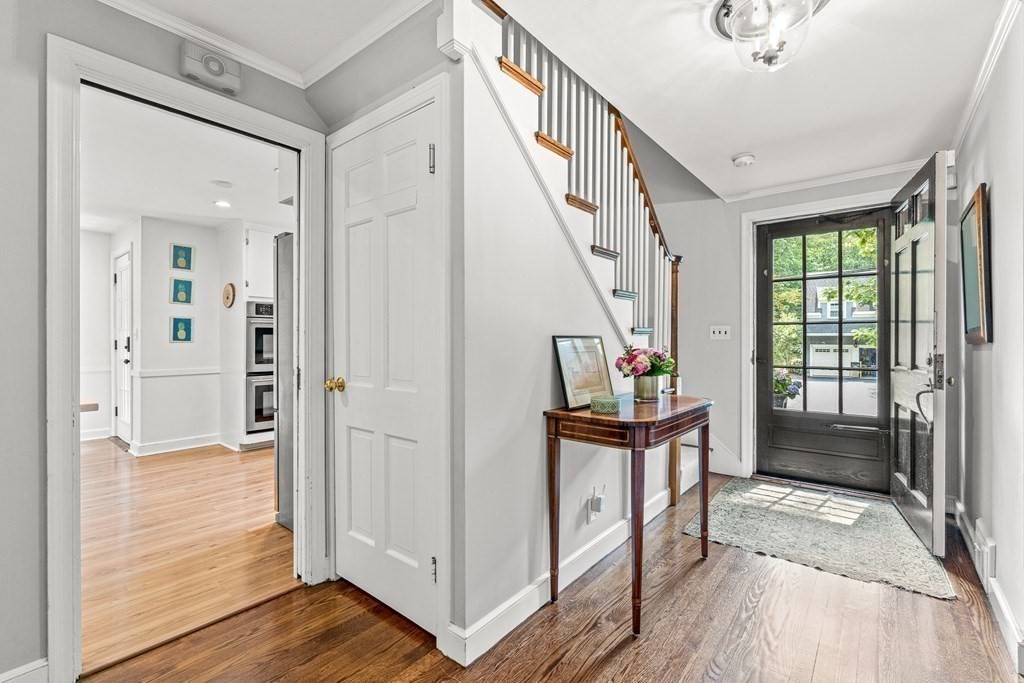104 Westgate Wellesley, MA 02481 - Photo 4 of 31 a view of a hallway with wooden floor and staircase