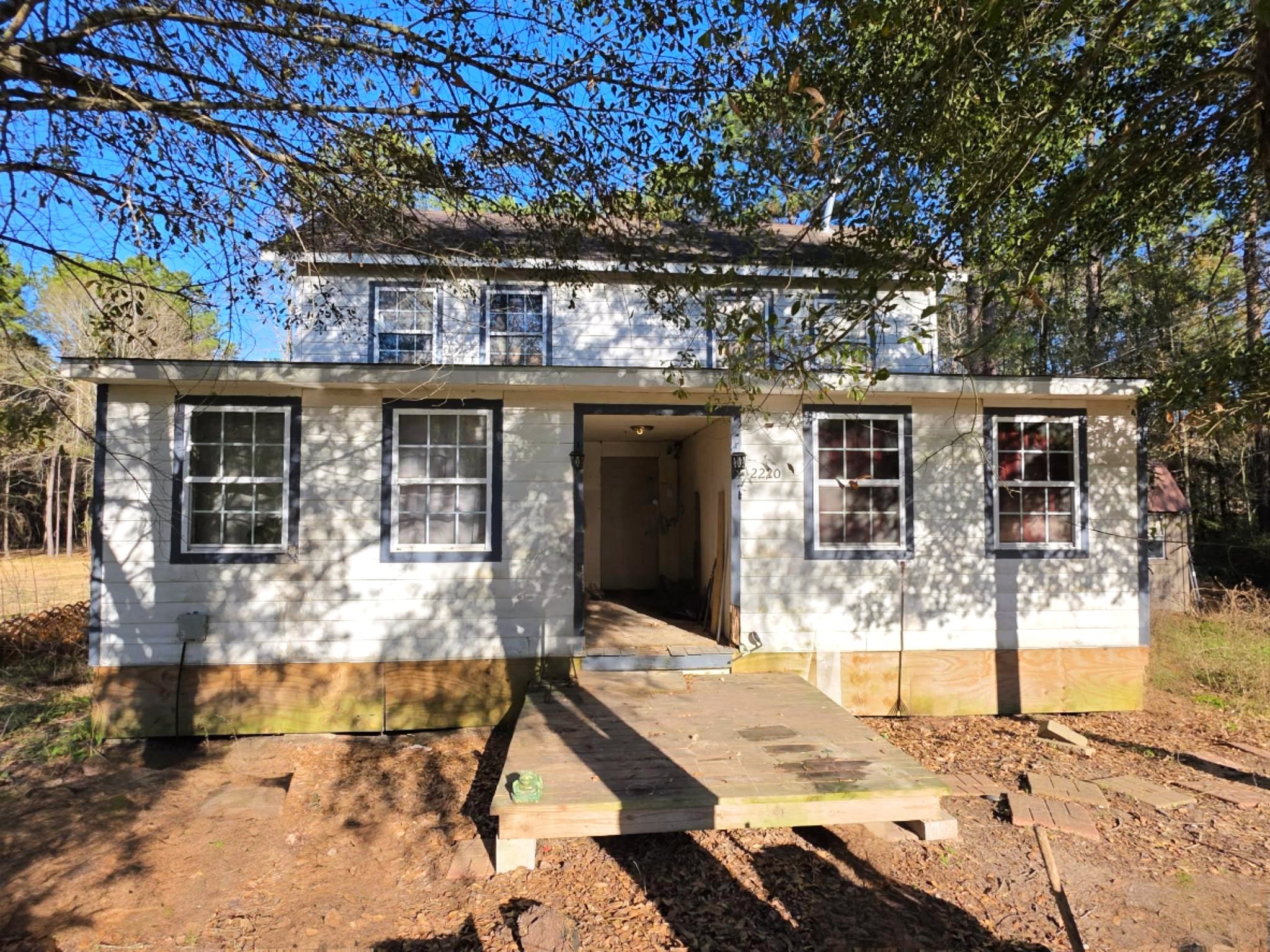 Ready for renovation! Country living at its best on 1.46 partially wooded and fenced acres.