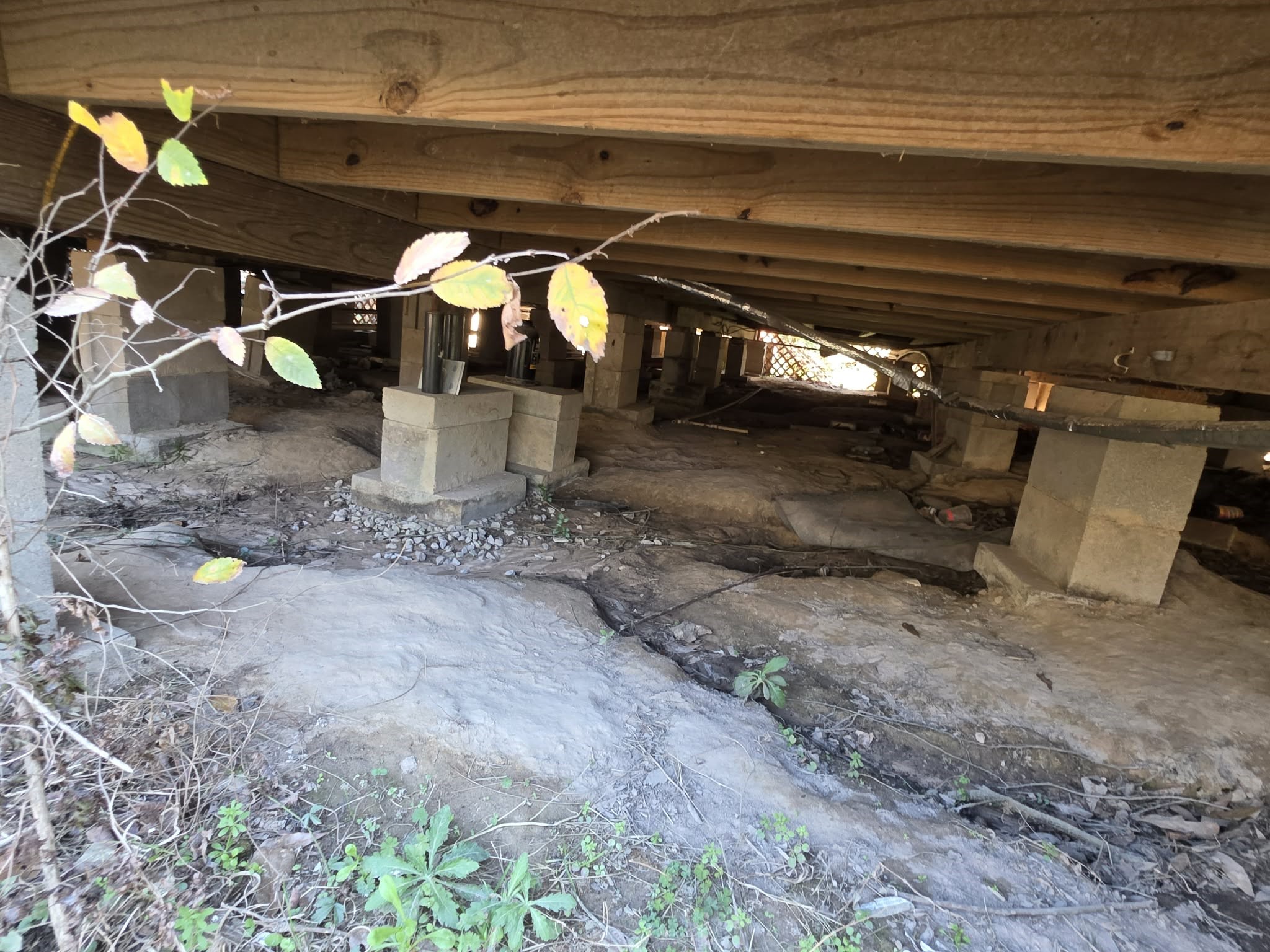 2220 Lee Turner Road Cleveland, TX 77328 - Photo 12 of 15 Sitting high up on piers, the home has a large crawl space for easy access to plumbing.