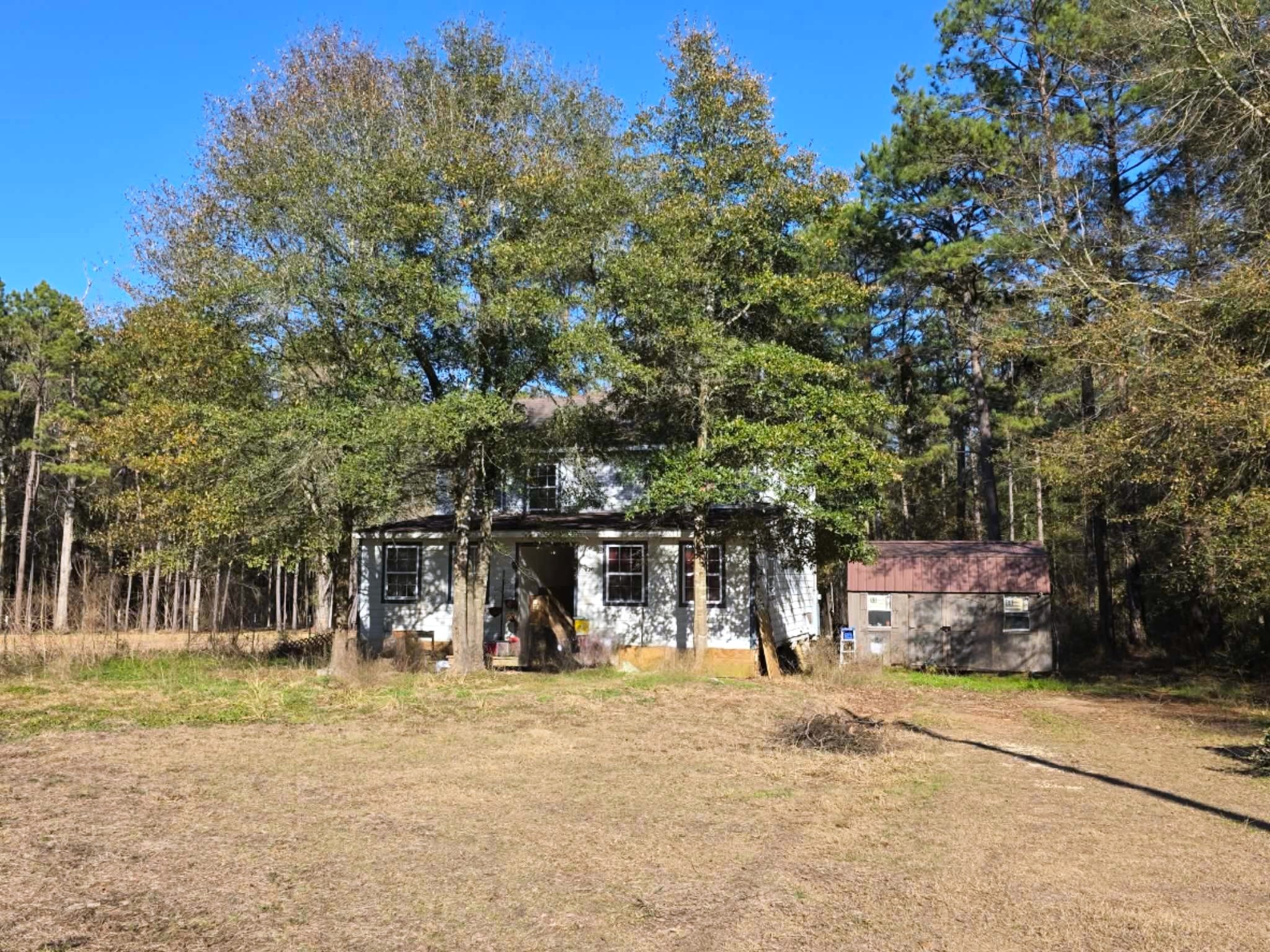 2220 Lee Turner Road Cleveland, TX 77328 - Photo 5 of 15 Approximately half of the acreage is your front yard. Ready for a playground, garden, dig a pond or just enjoy nature.