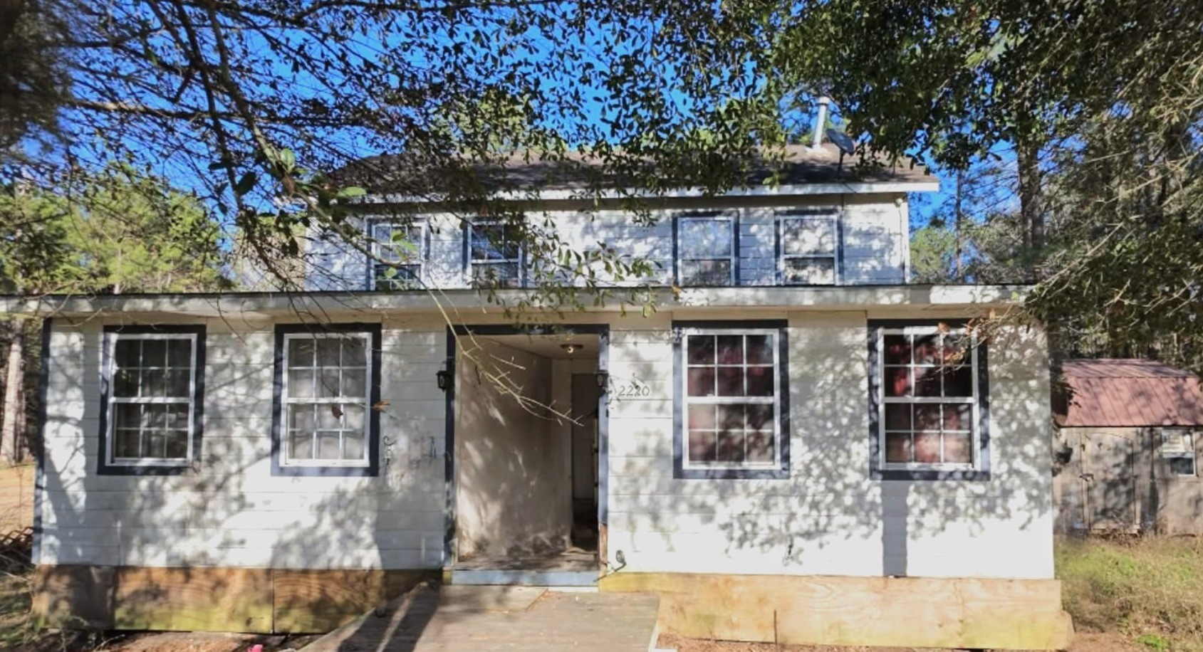 2220 Lee Turner Road Cleveland, TX 77328 - Photo 6 of 15 Two windows in the family room and two windows in the primary bedroom overlook the front yard, as well as two windows in both upstairs bedrooms.