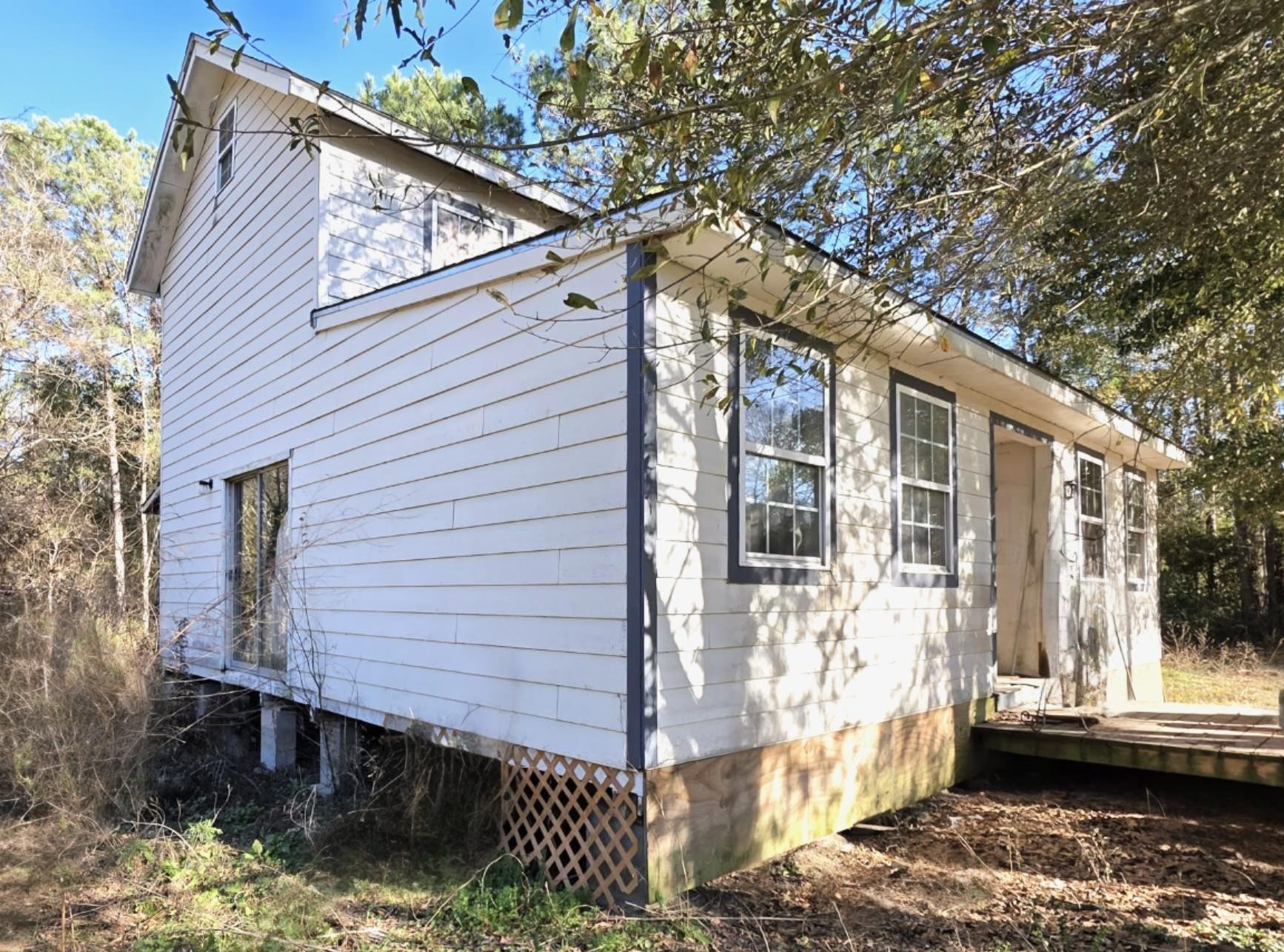 2220 Lee Turner Road Cleveland, TX 77328 - Photo 7 of 15 Add a side-porch to the north side of the home and step out of your dining area through the sliding patio door.
