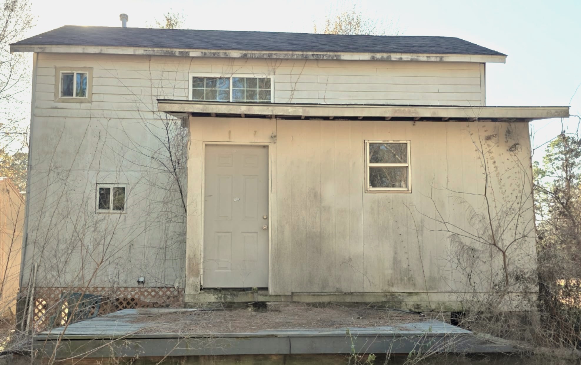 2220 Lee Turner Road Cleveland, TX 77328 - Photo 9 of 15 Step out of the kitchen onto your back porch. Add a pergola and and porch swing and enjoy the sunrises.