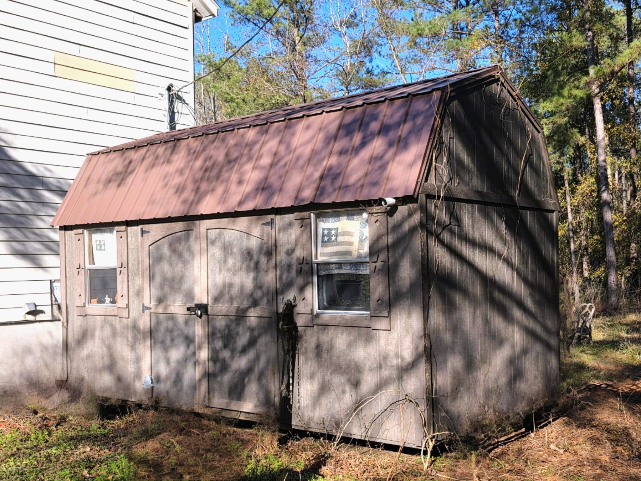 2220 Lee Turner Road Cleveland, TX 77328 - Photo 10 of 15 Approximately 16x12 foot storage building with a metal roof, high barn roof, double swinging doors and windows can be a workshop, garden shed, or anything your imagination can create.