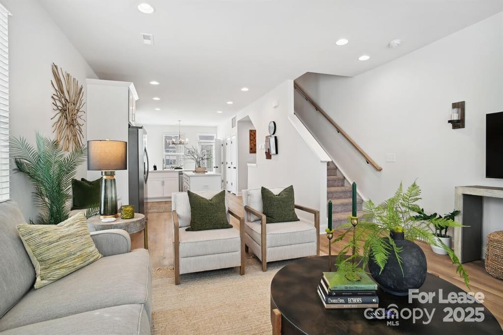 6134 Wilora Lake Road Charlotte, NC 28212 - Photo 13 of 21 a living room with furniture and a potted plant