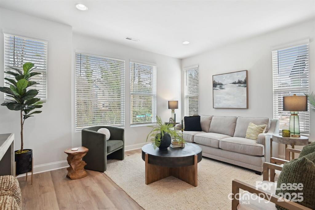 6134 Wilora Lake Road Charlotte, NC 28212 - Photo 7 of 21 a living room with furniture and a large window