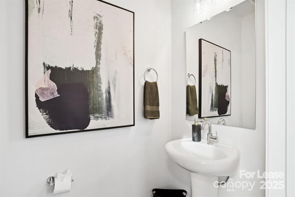 6134 Wilora Lake Road Charlotte, NC 28212 - Photo 10 of 21 a bathroom with a sink and mirror