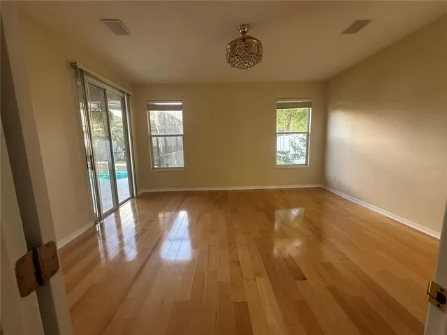 a spacious bathroom with a tub sink shower and mirror