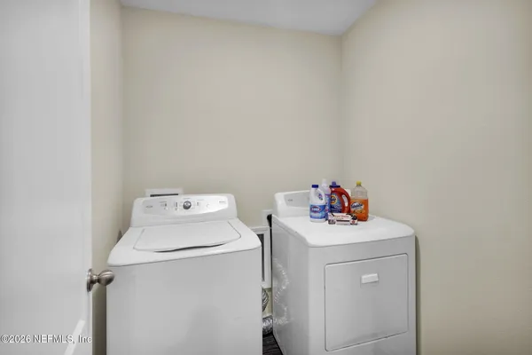 a utility room with dryer and washer