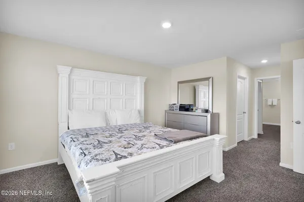 a living room with a bed and a couch