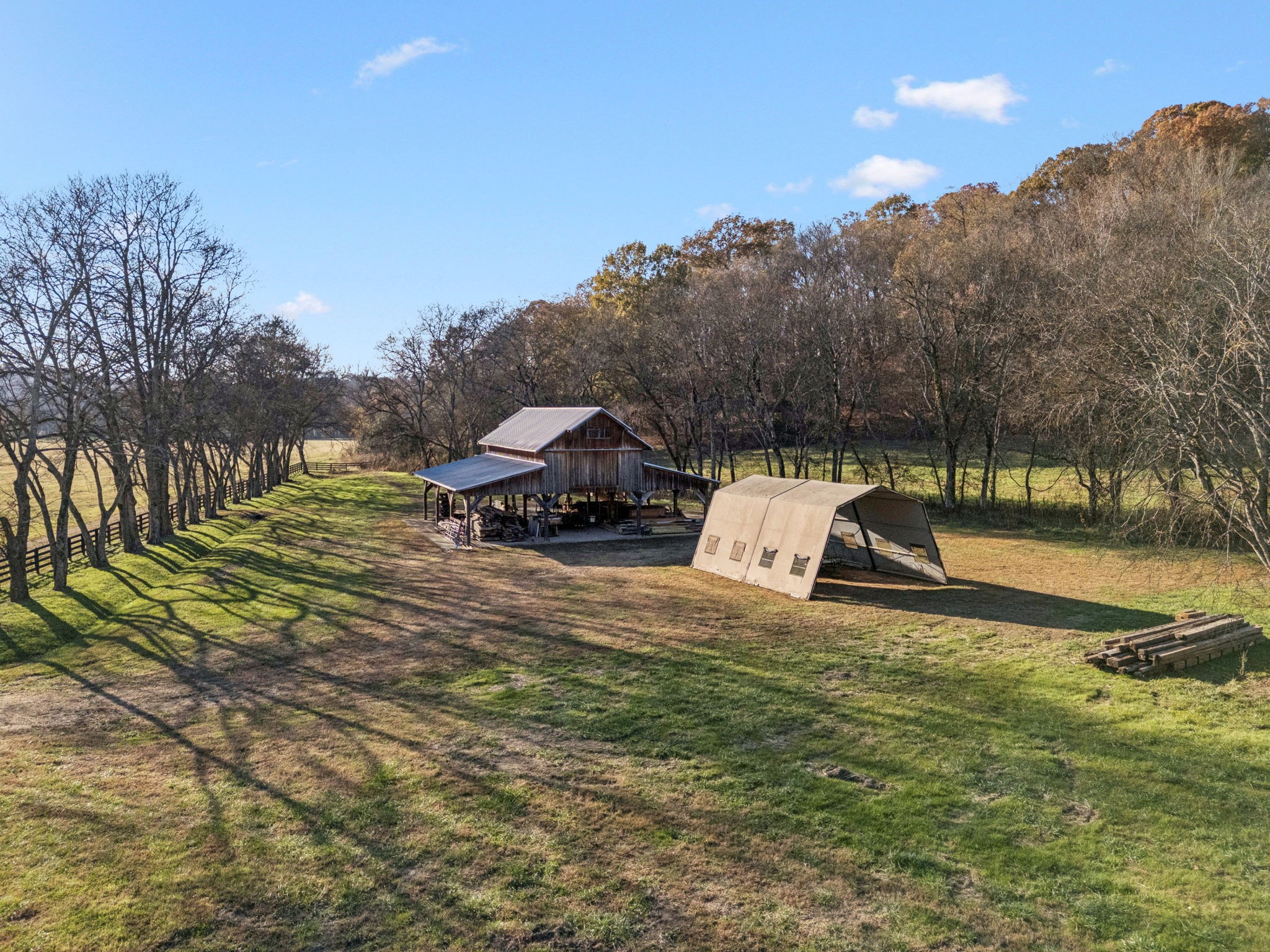 935 Leatherwood Creek Road Pulaski, TN 38478 - Photo 15 of 36 a view of a white house with a yard and sitting area