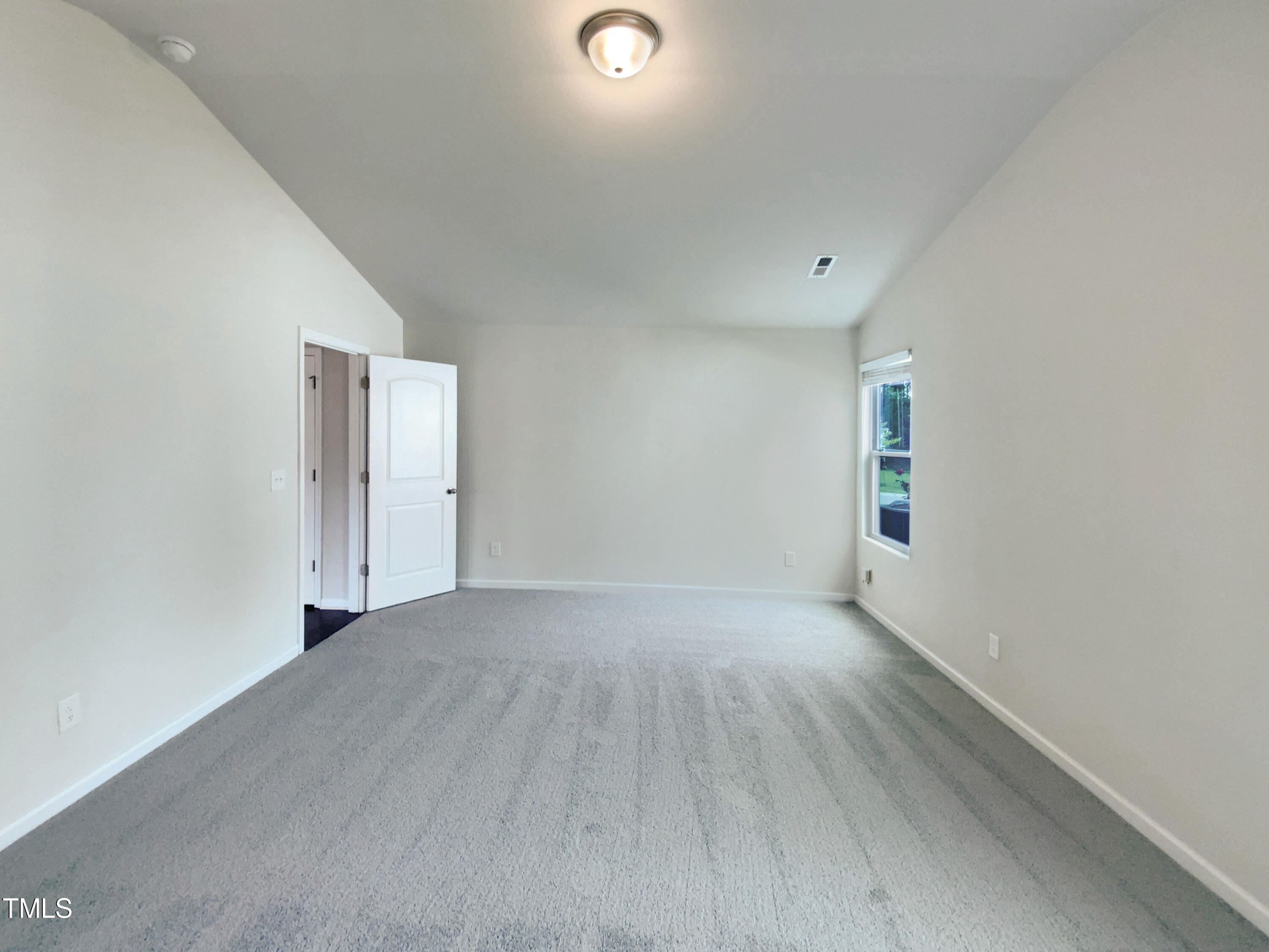 337 Rustling Way Zebulon, NC 27597 - Photo 12 of 19 a view of an empty room and window