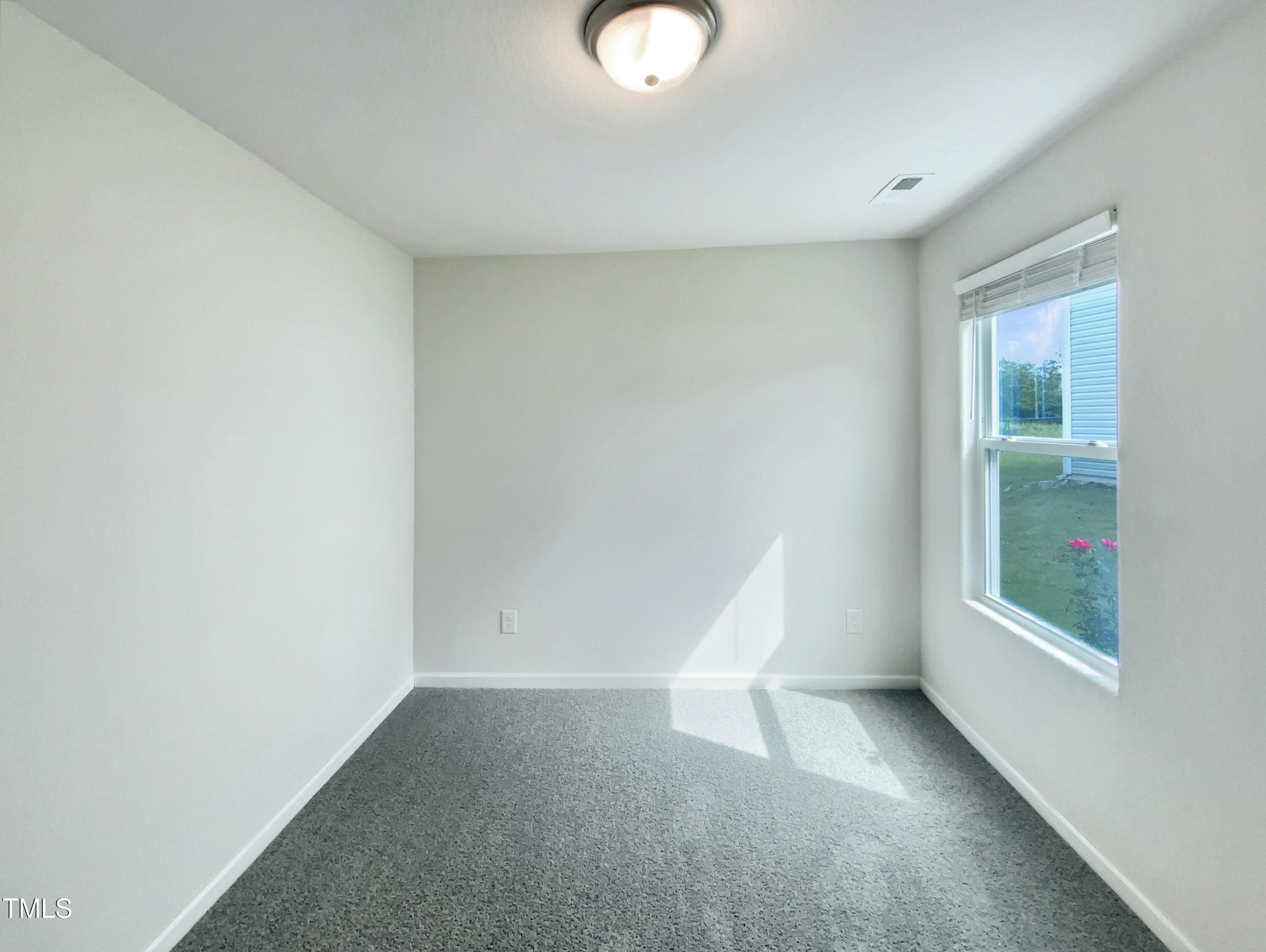 337 Rustling Way Zebulon, NC 27597 - Photo 15 of 19 wooden floor in an empty room with a window
