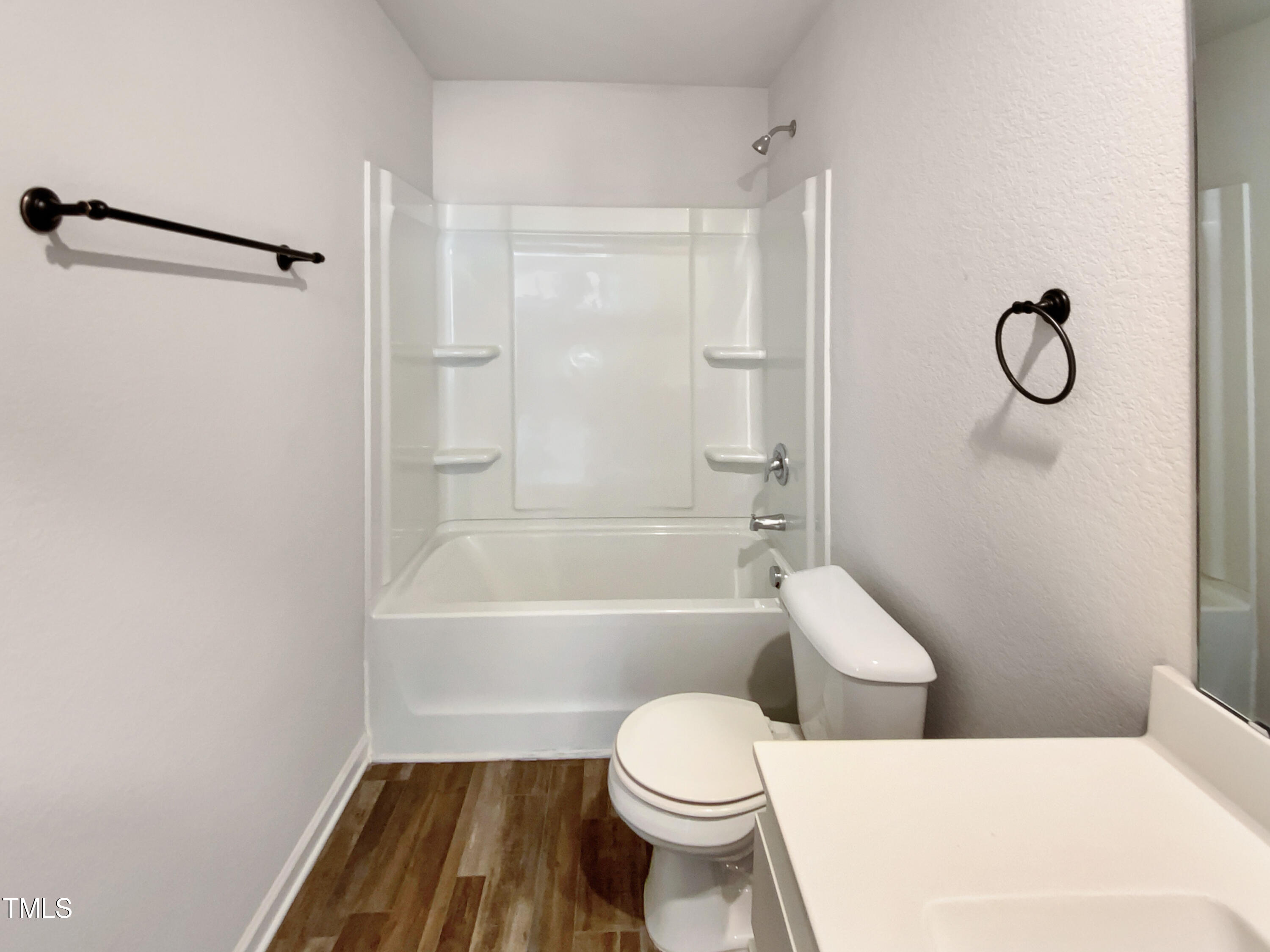 337 Rustling Way Zebulon, NC 27597 - Photo 17 of 19 a bathroom with a toilet and a shower