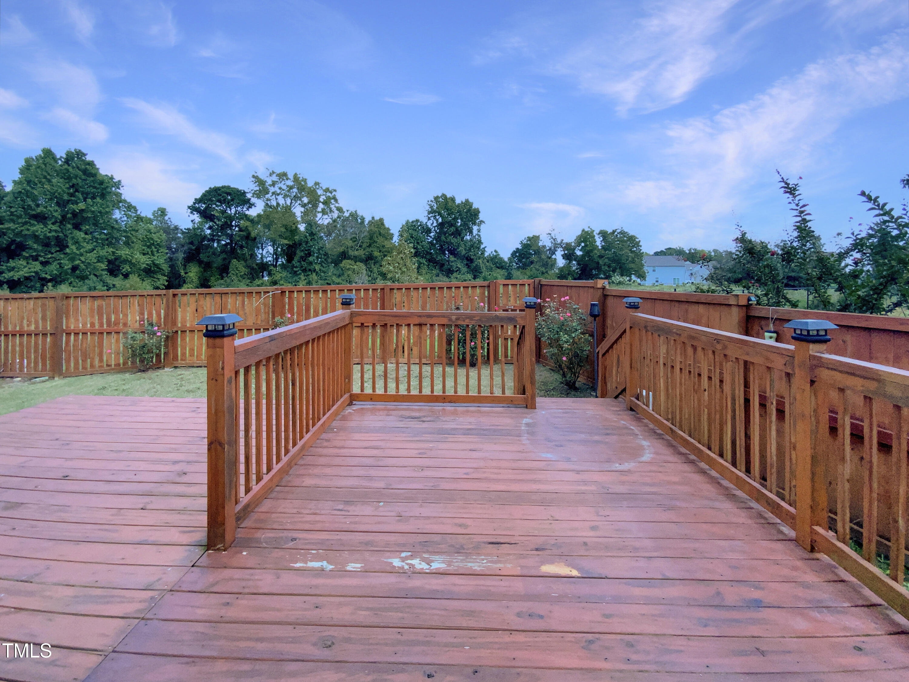 337 Rustling Way Zebulon, NC 27597 - Photo 18 of 19 a balcony with wooden floor