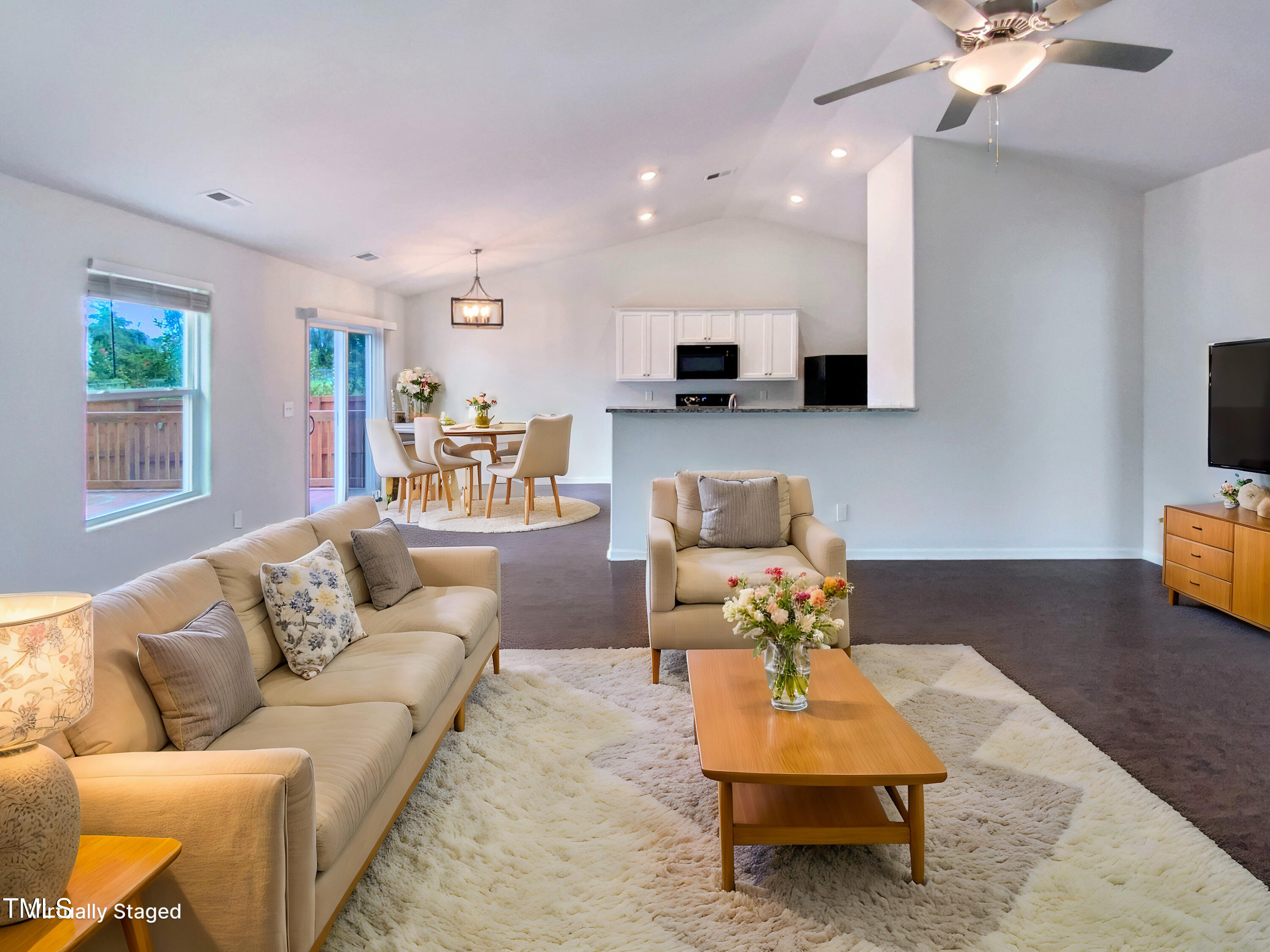 337 Rustling Way Zebulon, NC 27597 - Photo 2 of 19 a living room with furniture and a flat screen tv