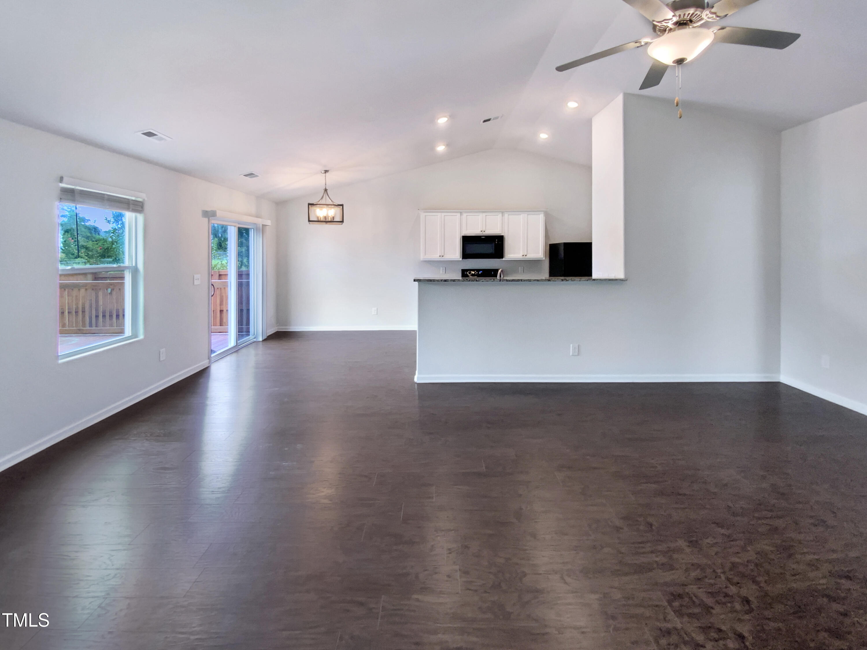 337 Rustling Way Zebulon, NC 27597 - Photo 3 of 19 a view of a livingroom with furniture wooden floor and a window