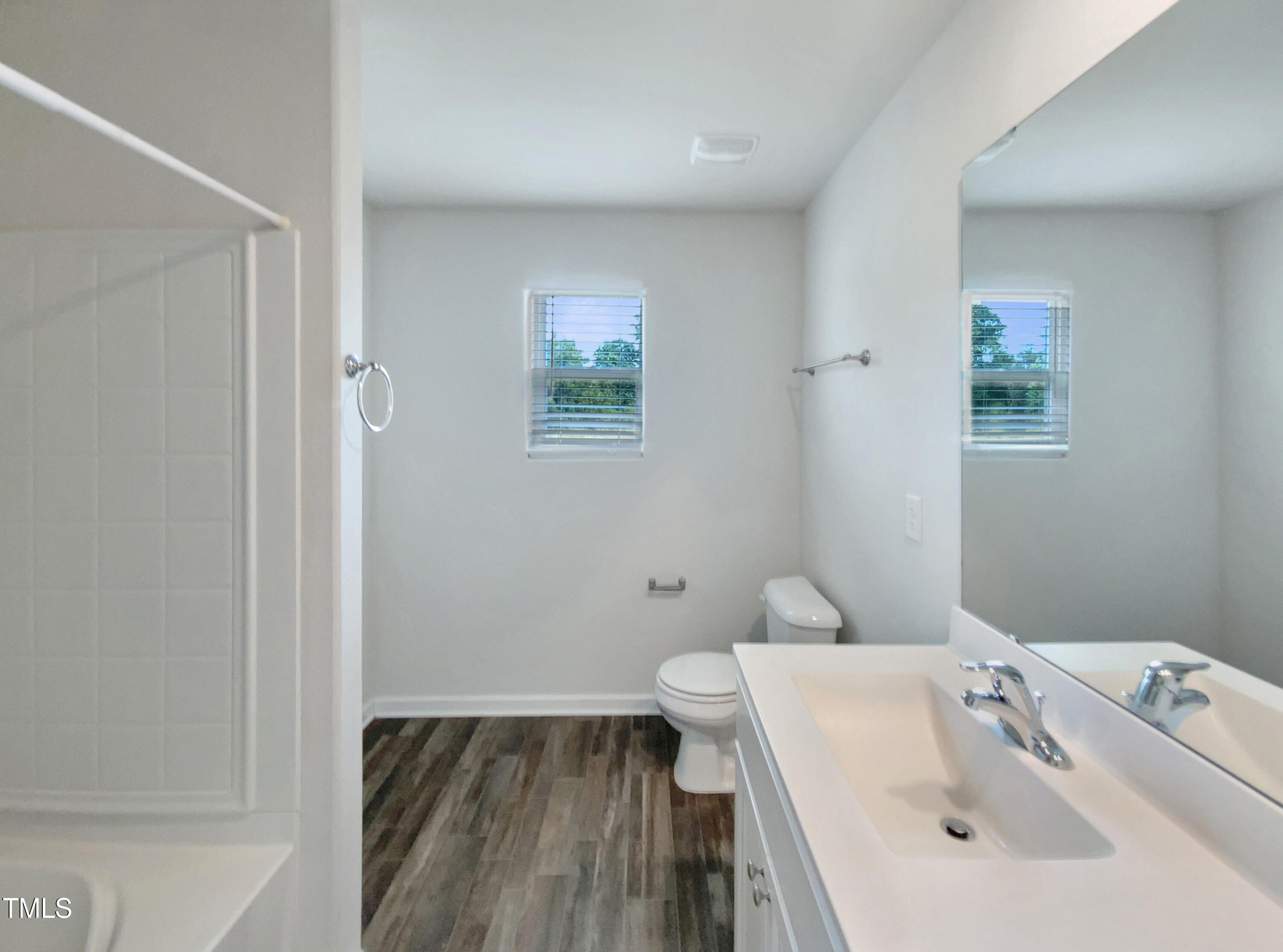 337 Rustling Way Zebulon, NC 27597 - Photo 7 of 19 a bathroom with a sink and toilet