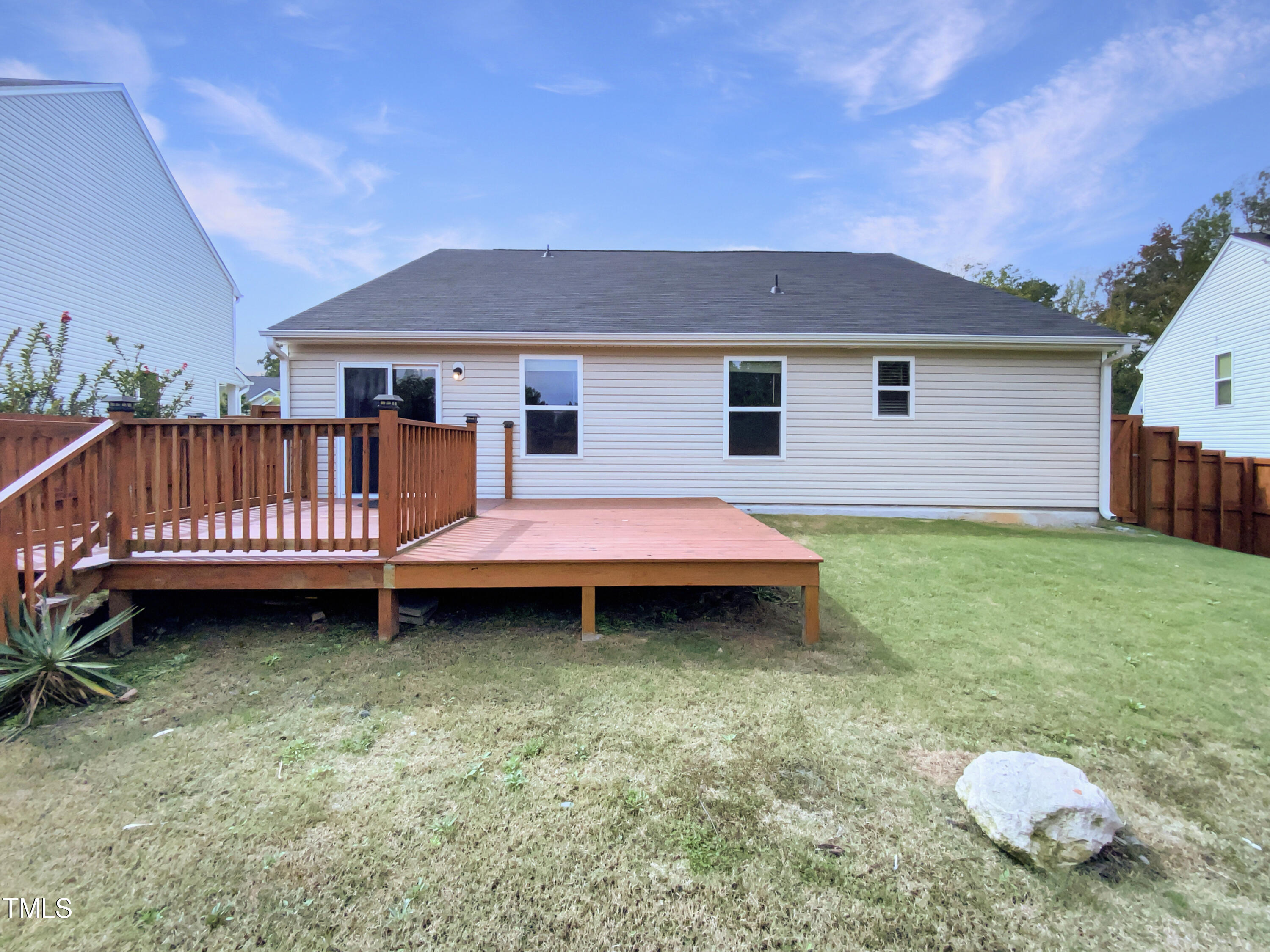 337 Rustling Way Zebulon, NC 27597 - Photo 8 of 19 a backyard of a house with table and chairs