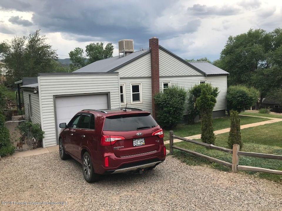 438 Munro Avenue Rifle, CO 81650 - Photo 3 of 3 a car parked in front of a house