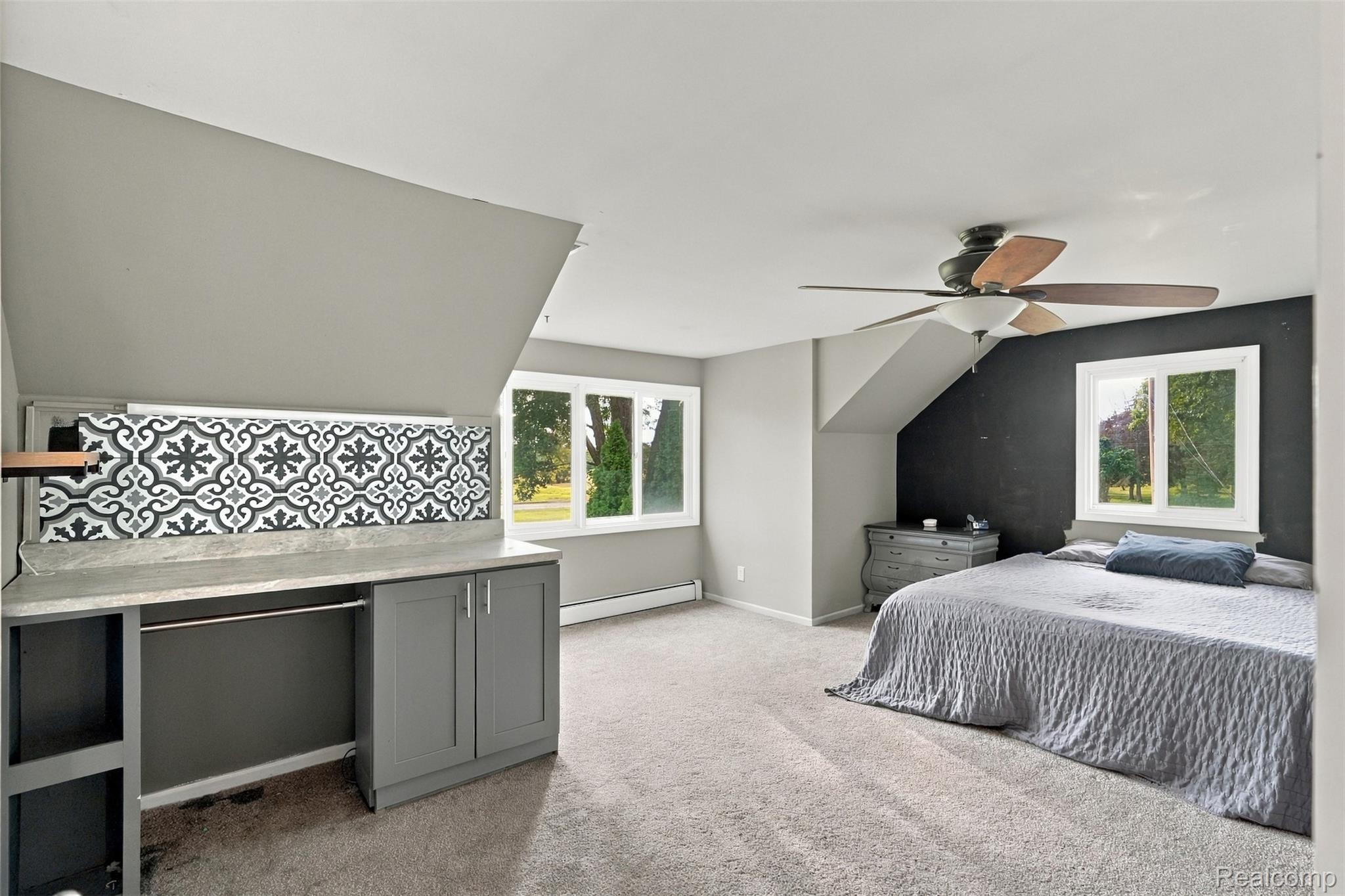 26516 Romine Road New Boston, MI 48164 - Photo 22 of 62 Built-in desk area with patterned tile accent, integrated storage, and a light-toned countertop
