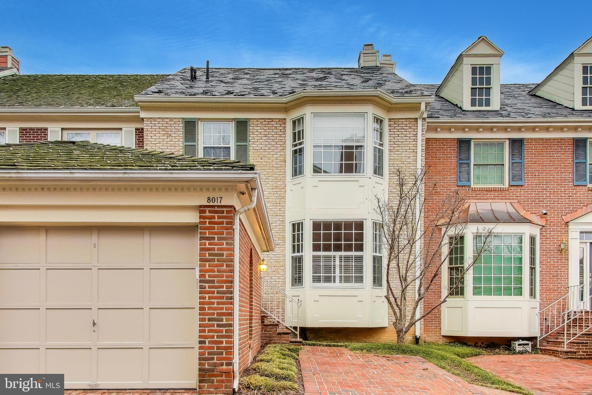8017 Rising Ridge Road Bethesda, MD 20817 - Photo 1 of 54 a front view of a house with a yard