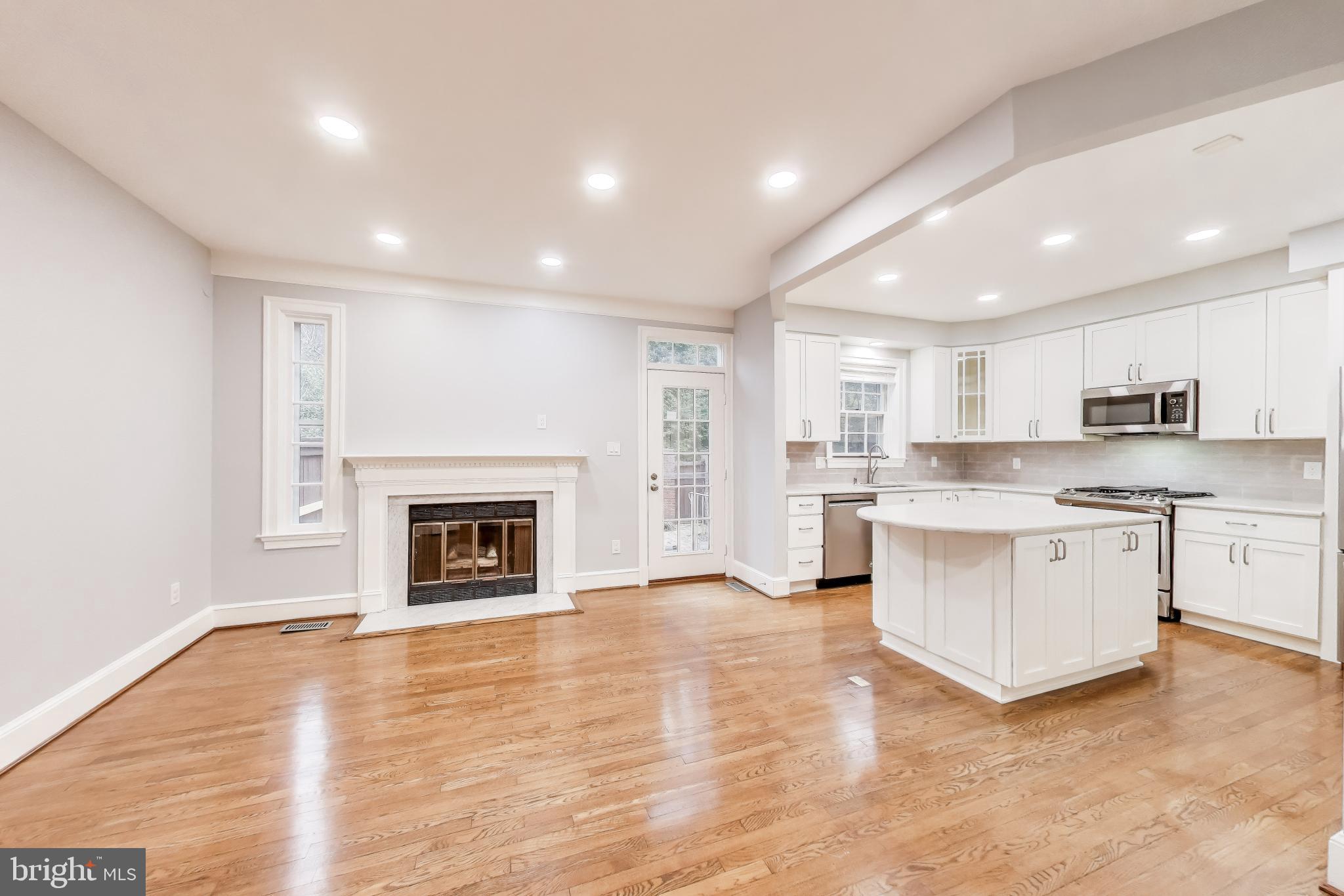 8017 Rising Ridge Road Bethesda, MD 20817 - Photo 13 of 54 a view of kitchen with granite countertop stove top oven and cabinets