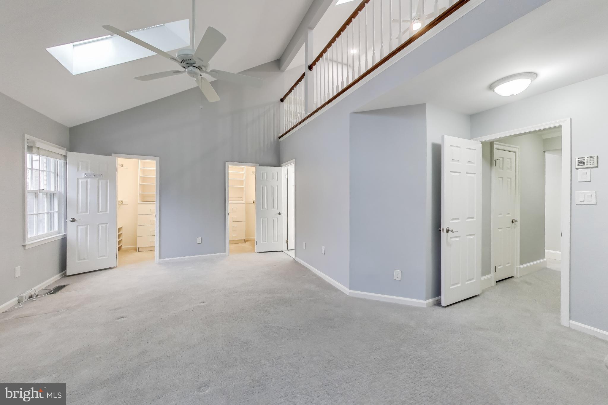 8017 Rising Ridge Road Bethesda, MD 20817 - Photo 18 of 54 an empty room with windows and fan