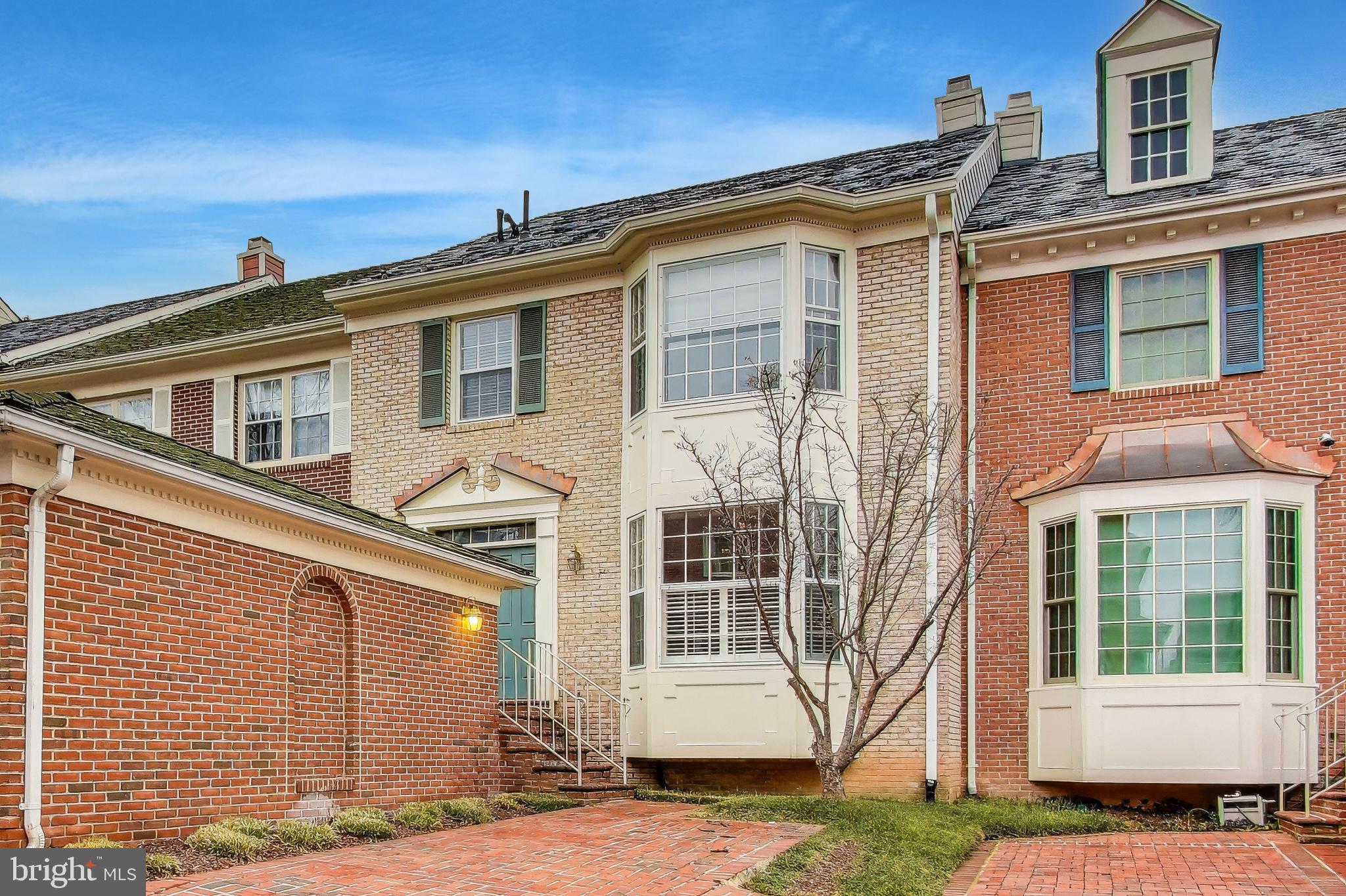 8017 Rising Ridge Road Bethesda, MD 20817 - Photo 2 of 54 a front view of a house with a yard