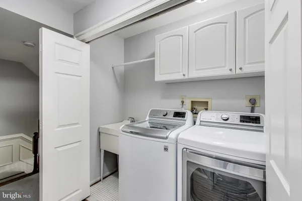 a view of a kitchen with a sink and a window