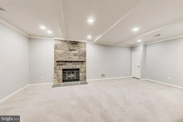 a view of an empty room with windows