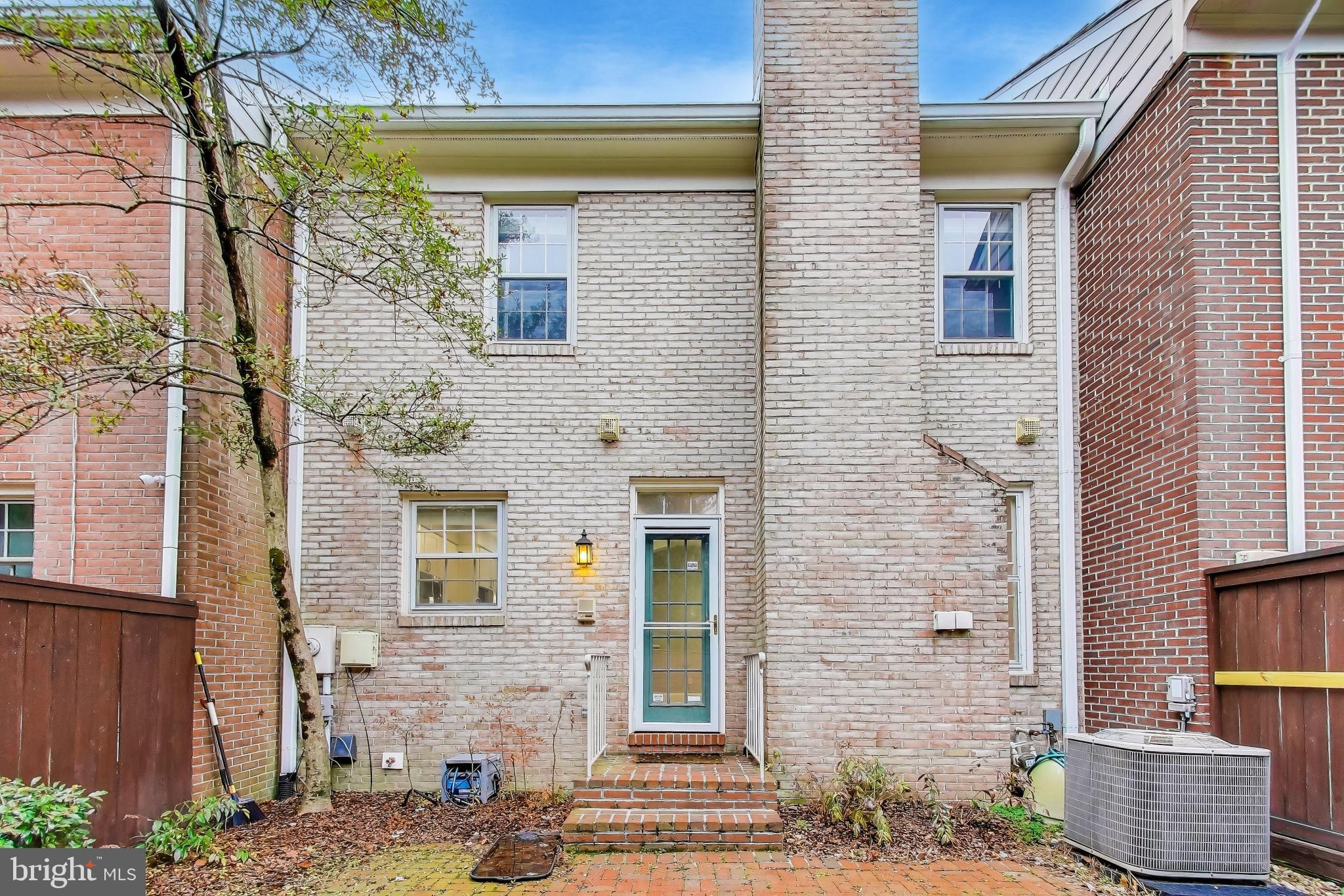 8017 Rising Ridge Road Bethesda, MD 20817 - Photo 46 of 54 a front view of a house with a garden