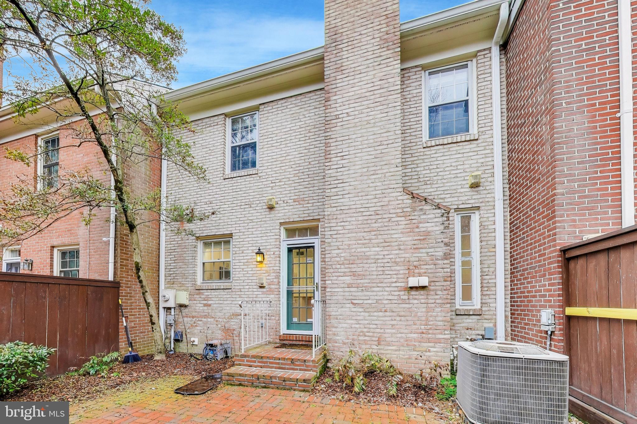 8017 Rising Ridge Road Bethesda, MD 20817 - Photo 47 of 54 a front view of a house with a yard