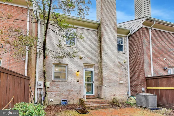 a picture of a bench in front of a wall