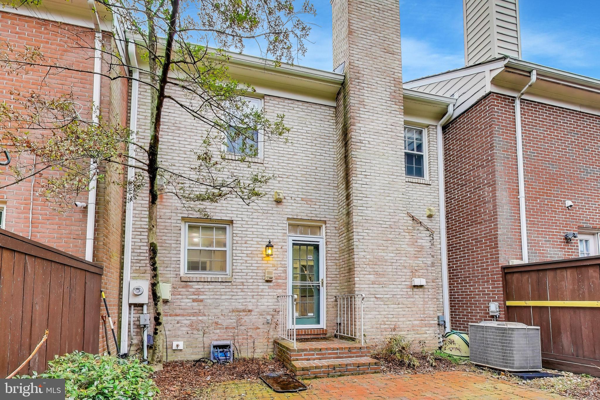 8017 Rising Ridge Road Bethesda, MD 20817 - Photo 48 of 54 a front view of a house with a garden