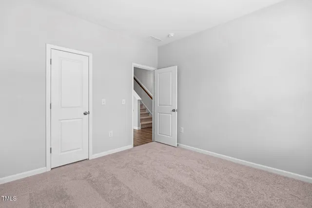 a bathroom with a granite countertop sink a toilet a mirror and shower
