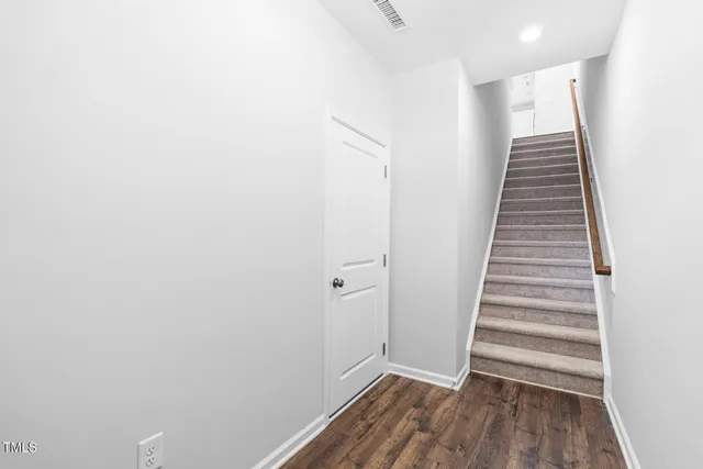 a view of entryway with wooden floor